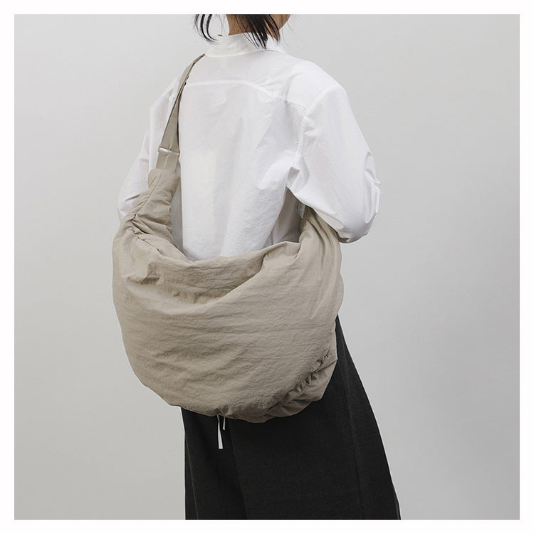 Women’s Nylon Tote Bag With Dumpling Shape Featuring Sewing Thread And Single Shoulder Strap