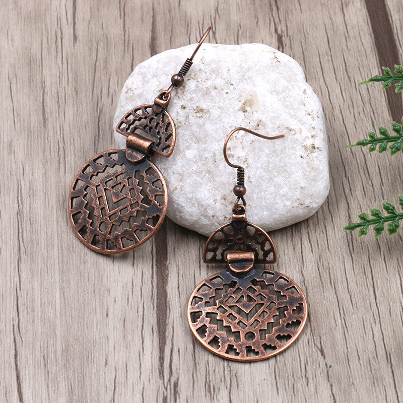 Hollow round alloy earrings