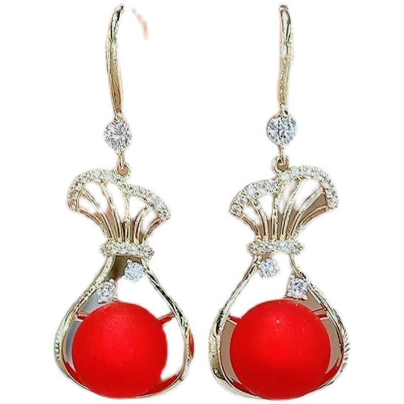 Red purse pearl earrings