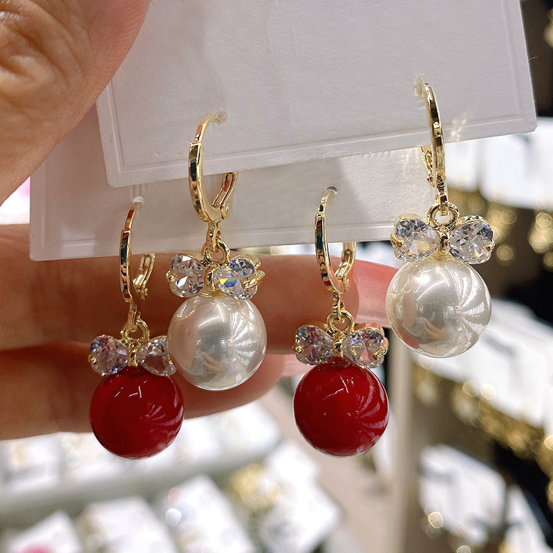 Zircon bow pearl earrings