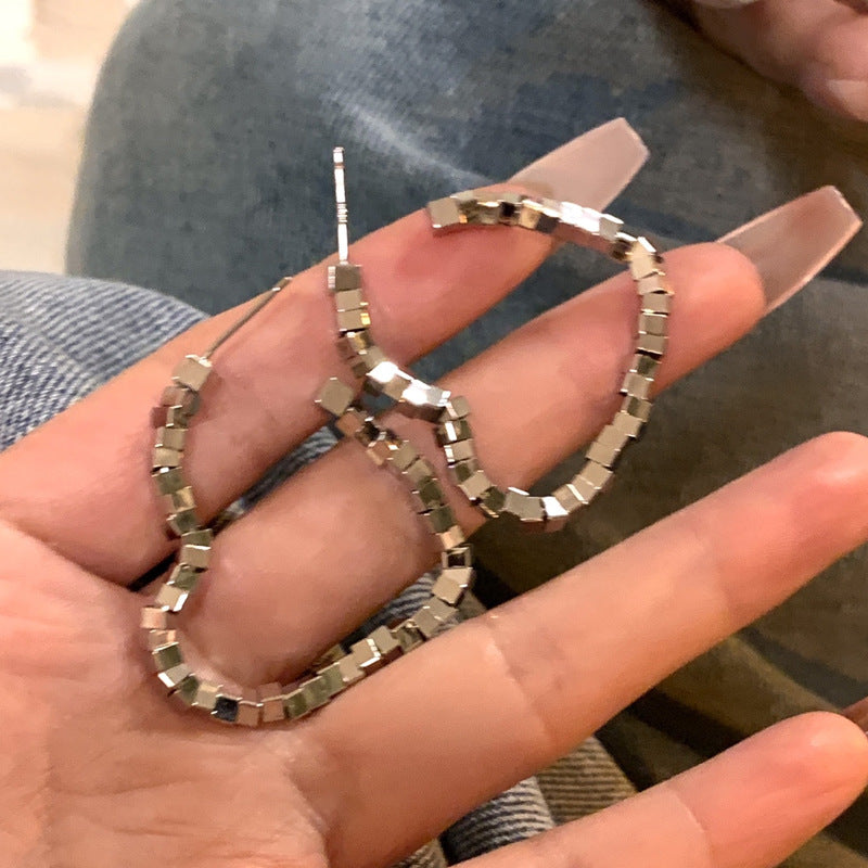 Broken silver love earrings