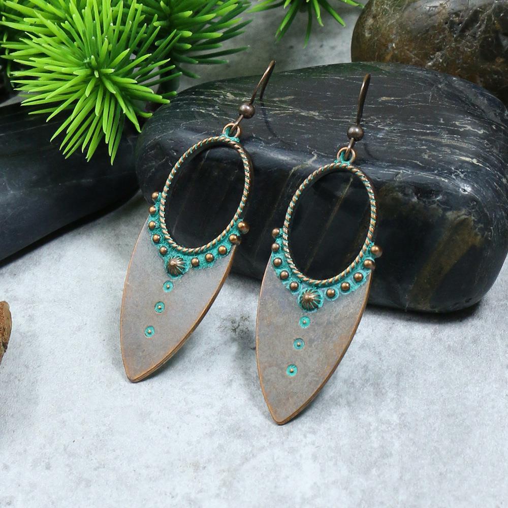 Irregular leaves hollowed out turquoise earrings