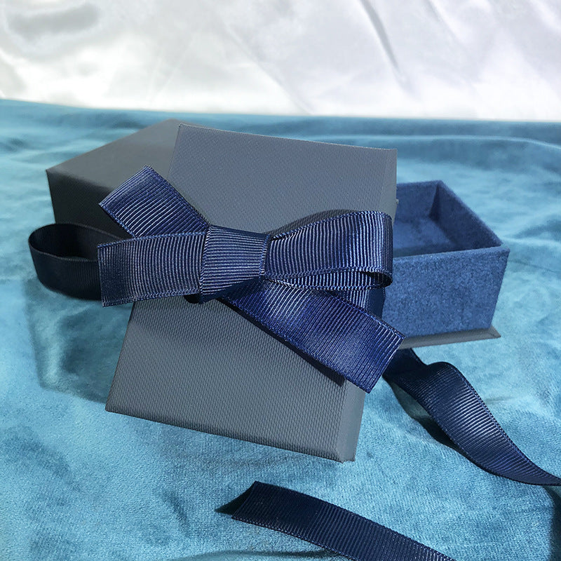 Paper Jewelry Box With Bow Tie Design In Dark Blue, Featuring Love Charms For Elegant Jewelry Packaging