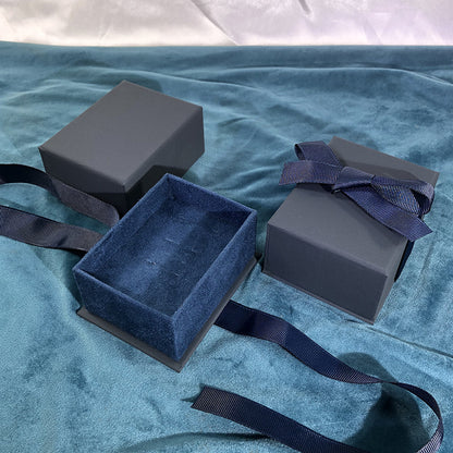 Paper Jewelry Box With Bow Tie Design In Dark Blue, Featuring Love Charms For Elegant Jewelry Packaging