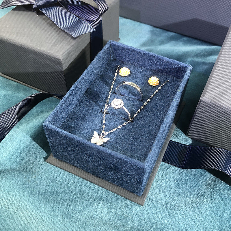 Paper Jewelry Box With Bow Tie Design In Dark Blue, Featuring Love Charms For Elegant Jewelry Packaging