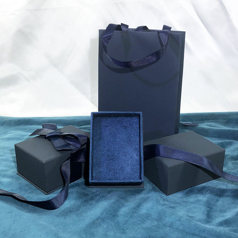 Paper Jewelry Box With Bow Tie Design In Dark Blue, Featuring Love Charms For Elegant Jewelry Packaging