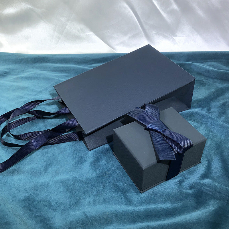 Paper Jewelry Box With Bow Tie Design In Dark Blue, Featuring Love Charms For Elegant Jewelry Packaging