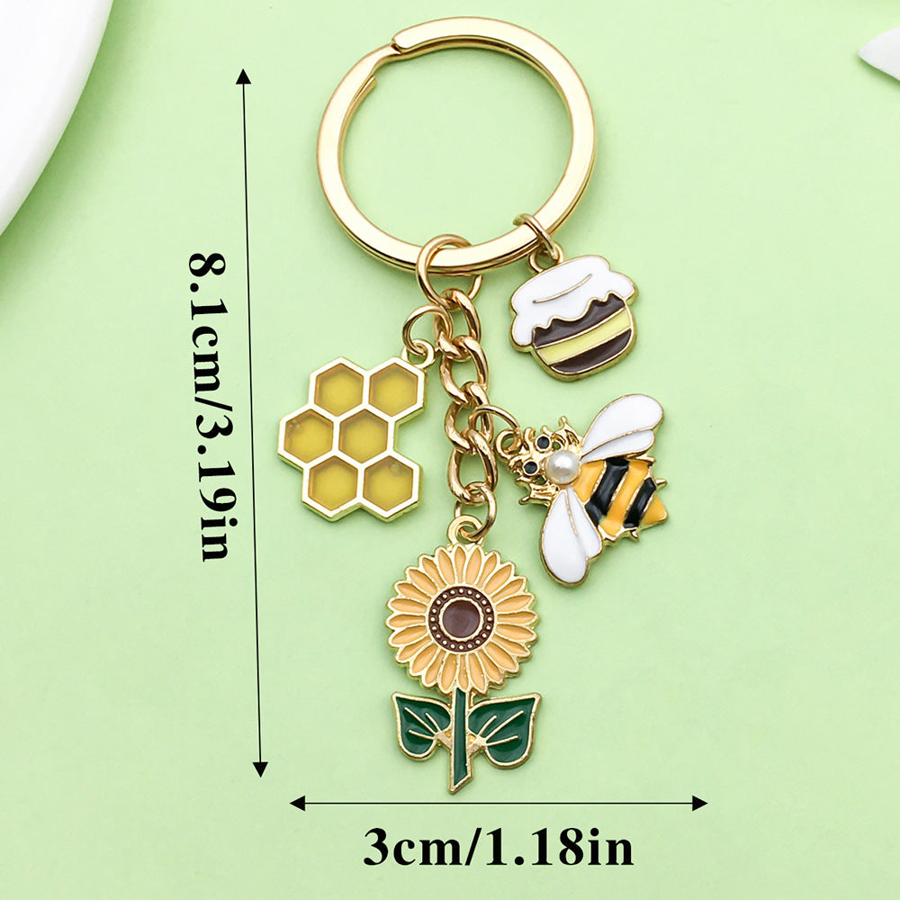 Bee Honeycomb Pendant Featuring A Detailed Bee Pattern In Durable Alloy, Available In Yellow
