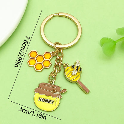 Bee Honeycomb Pendant Featuring A Detailed Bee Pattern In Durable Alloy, Available In Yellow