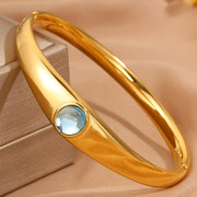 Gold Curved Blue Circle Bracelet