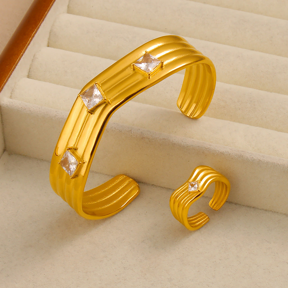 Women’s Titanium Steel Bangle With Golden Plated Finish And Zircon Inlay Featuring Elegant Line Pattern