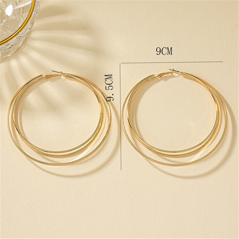 Round Gold Earrings Featuring Geometric Design, Perfect For Elegant Everyday Wear