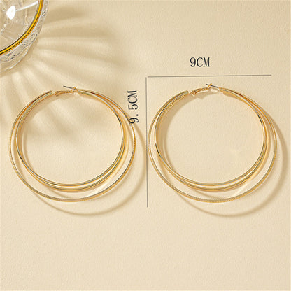Round Gold Earrings Featuring Geometric Design, Perfect For Elegant Everyday Wear