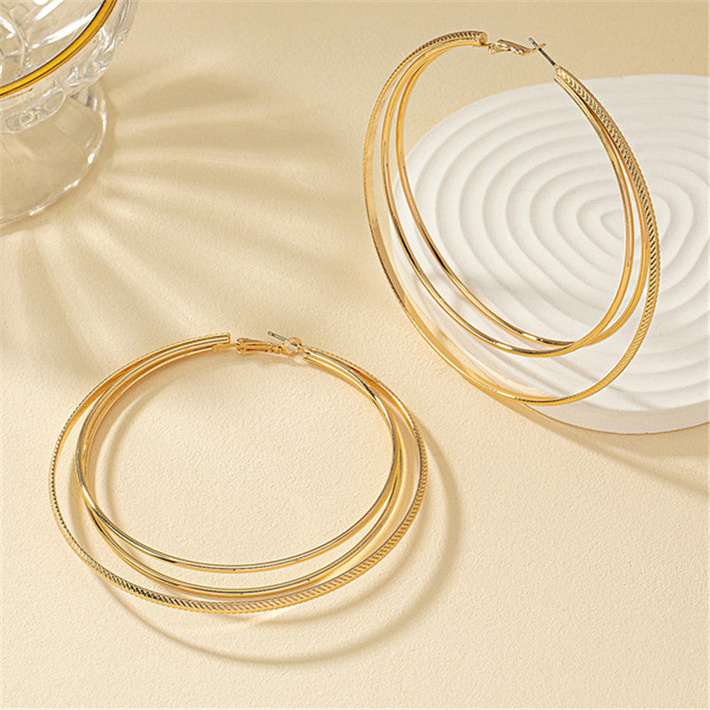 Round Gold Earrings Featuring Geometric Design, Perfect For Elegant Everyday Wear