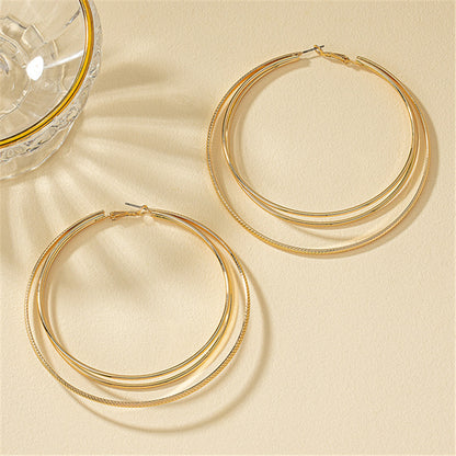 Round Gold Earrings Featuring Geometric Design, Perfect For Elegant Everyday Wear