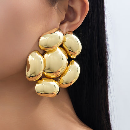 Exaggerated Petal Earrings In Gold, Featuring A Bold And Stylish Design For A Unique Look