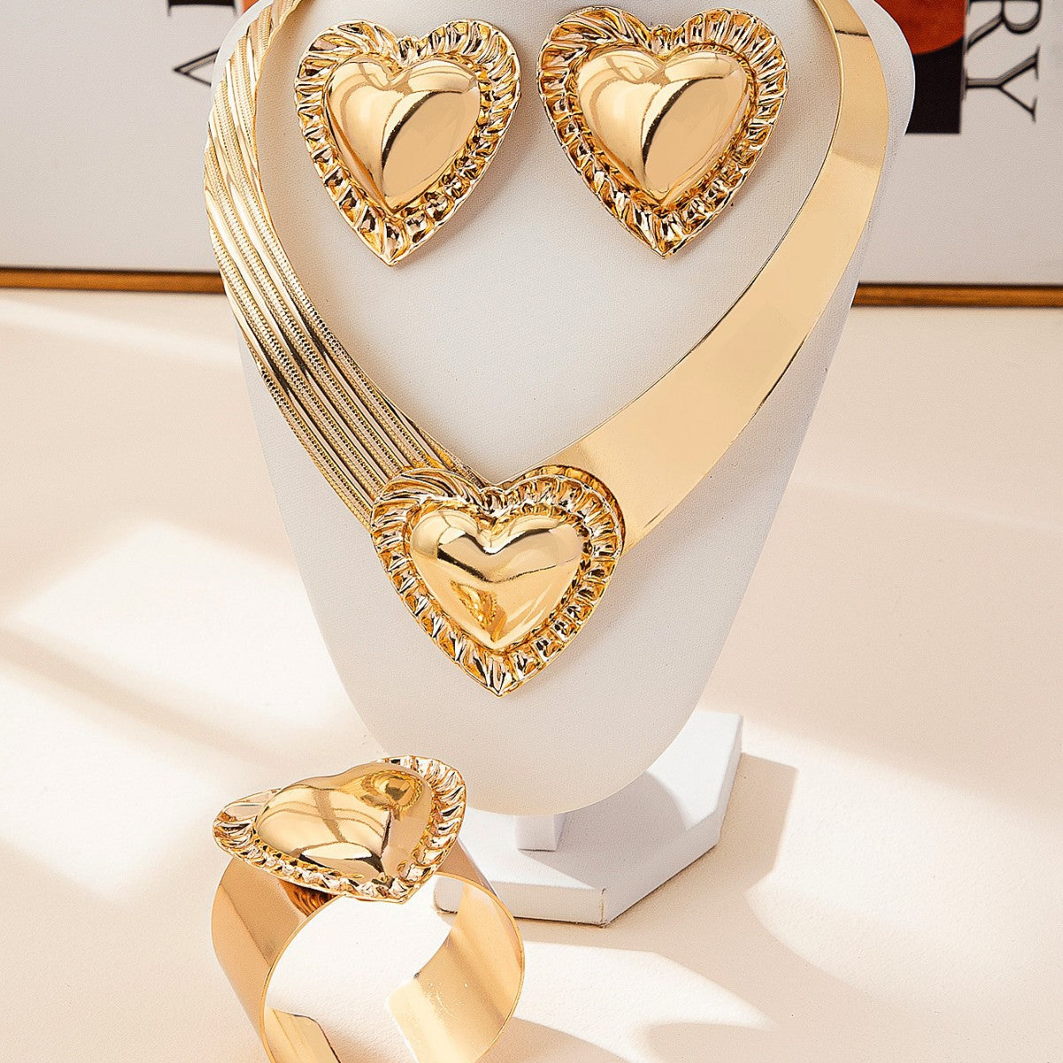 Golden Jewelry Set Featuring Heart Shape Pattern Made Of Metal