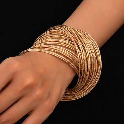 Gold And Silver Punk Style Bangle For A Bold, Simple Gothic Look