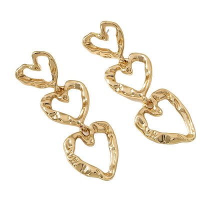 For Women Golden Heart-Shaped Stud Earrings Featuring Electroplated Finish, Fashion Commuter Style From Qingdao, Spring