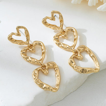 For Women Golden Heart-Shaped Stud Earrings Featuring Electroplated Finish, Fashion Commuter Style From Qingdao, Spring