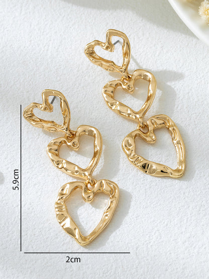 For Women Golden Heart-Shaped Stud Earrings Featuring Electroplated Finish, Fashion Commuter Style From Qingdao, Spring