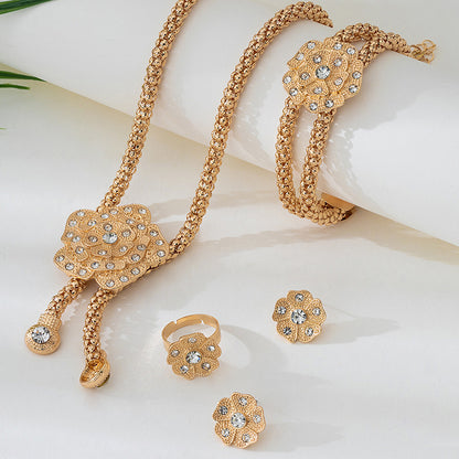 Golden Jewelry Set Featuring Elegant Flower Patterns