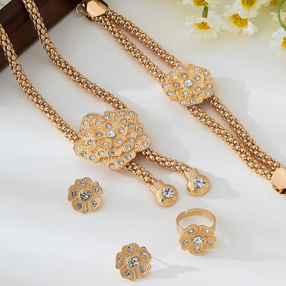 Golden Jewelry Set Featuring Elegant Flower Patterns
