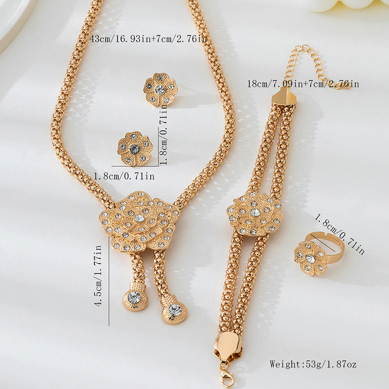 Golden Jewelry Set Featuring Elegant Flower Patterns