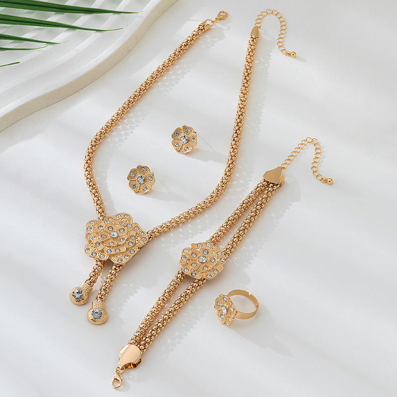 Golden Jewelry Set Featuring Elegant Flower Patterns