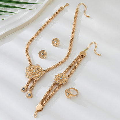 Golden Jewelry Set Featuring Elegant Flower Patterns