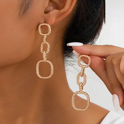 Retro Gold Drop Earrings Featuring A Geometric Knot Circle Design For Elegant Style