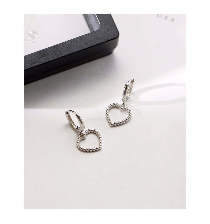 Heart Hoops Earrings In White Featuring Elegant Heart Shape Design For Stylish Wear