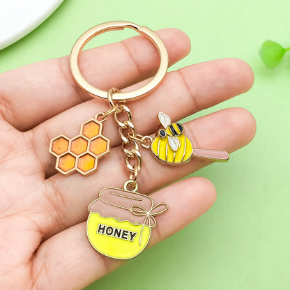 Bee Honeycomb Pendant Featuring A Detailed Bee Pattern In Durable Alloy, Available In Yellow