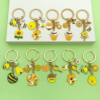 Bee Honeycomb Pendant Featuring A Detailed Bee Pattern In Durable Alloy, Available In Yellow