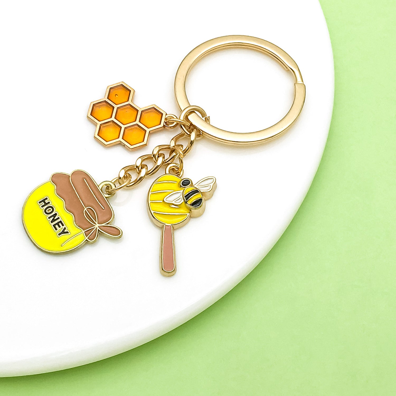 Bee Honeycomb Pendant Featuring A Detailed Bee Pattern In Durable Alloy, Available In Yellow