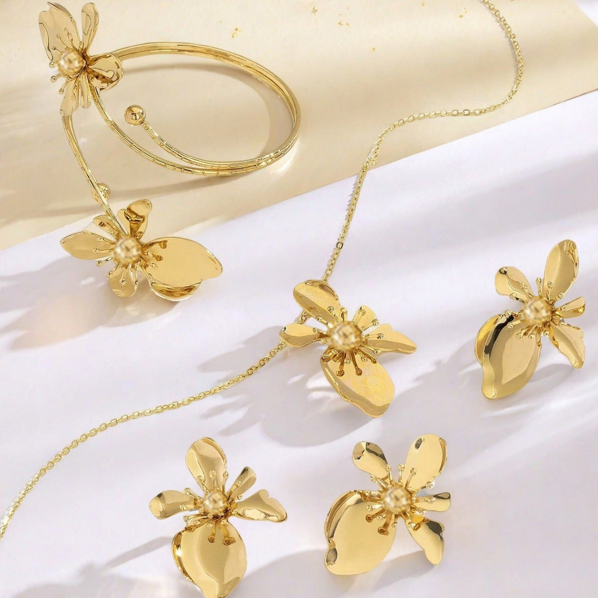 Golden Jewelry Set Featuring Flower Patterns Made Of Durable Metal