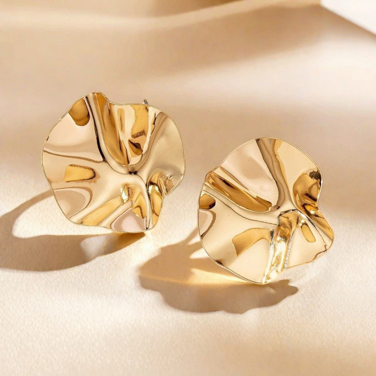 Golden Metal Folds Stud Earrings For Women Featuring Elegant Design