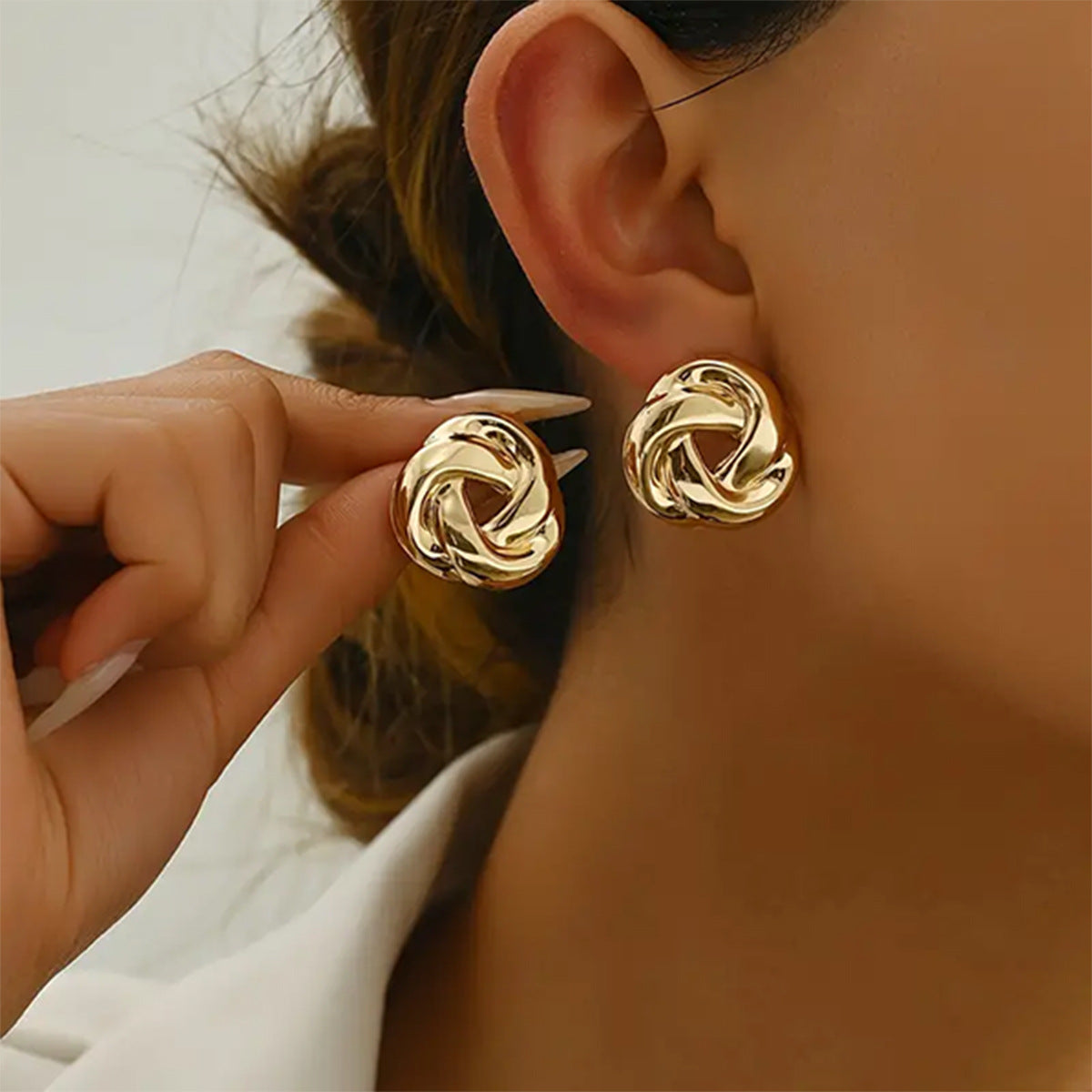 Golden Alloy Twist Stud Earrings For Women Featuring Elegant Craftsmanship