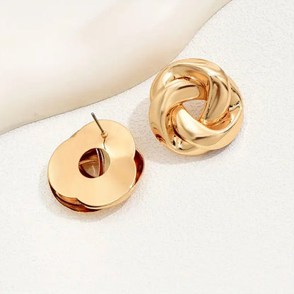 Golden Alloy Twist Stud Earrings For Women Featuring Elegant Craftsmanship