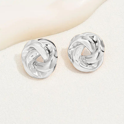 Golden Alloy Twist Stud Earrings For Women Featuring Elegant Craftsmanship