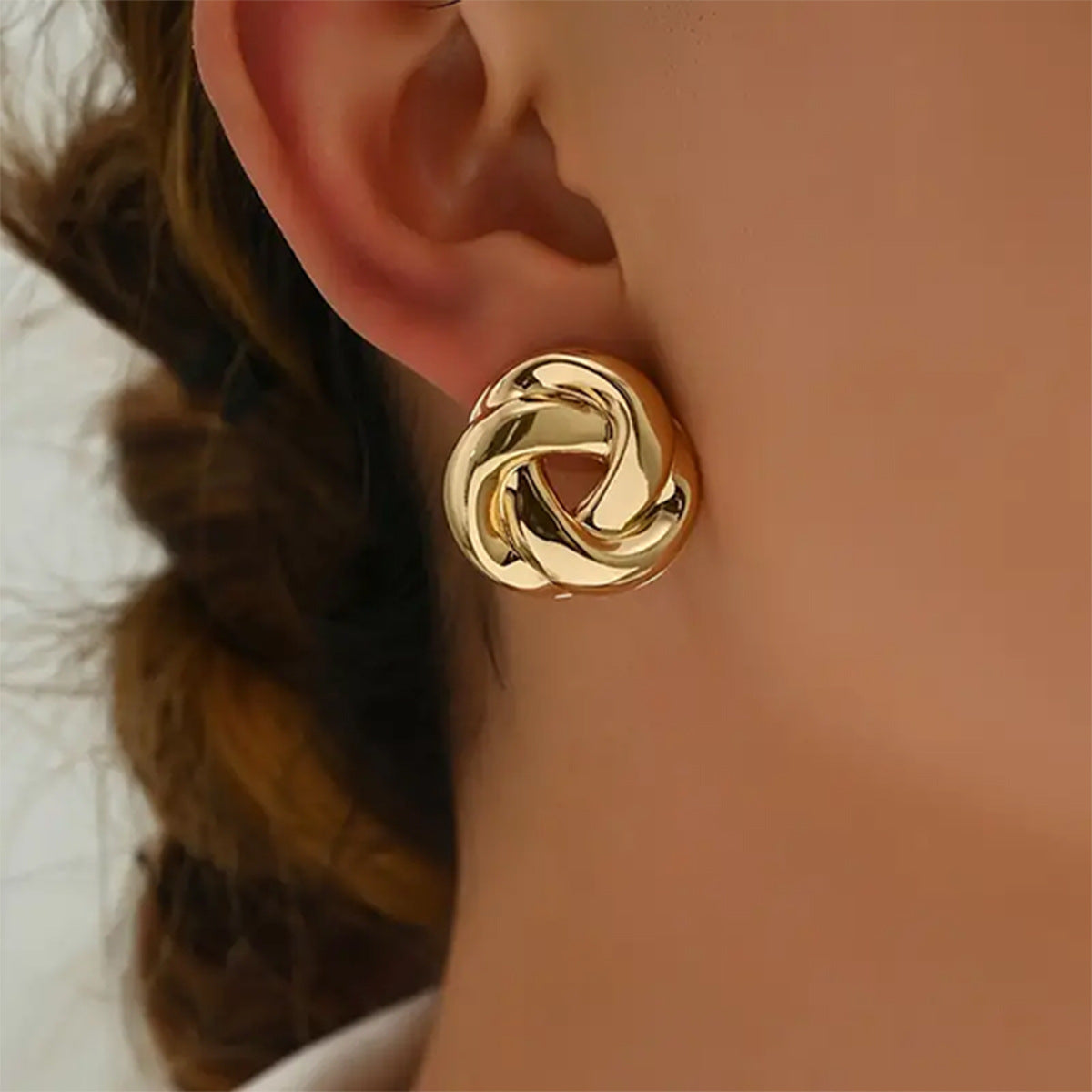 Golden Alloy Twist Stud Earrings For Women Featuring Elegant Craftsmanship