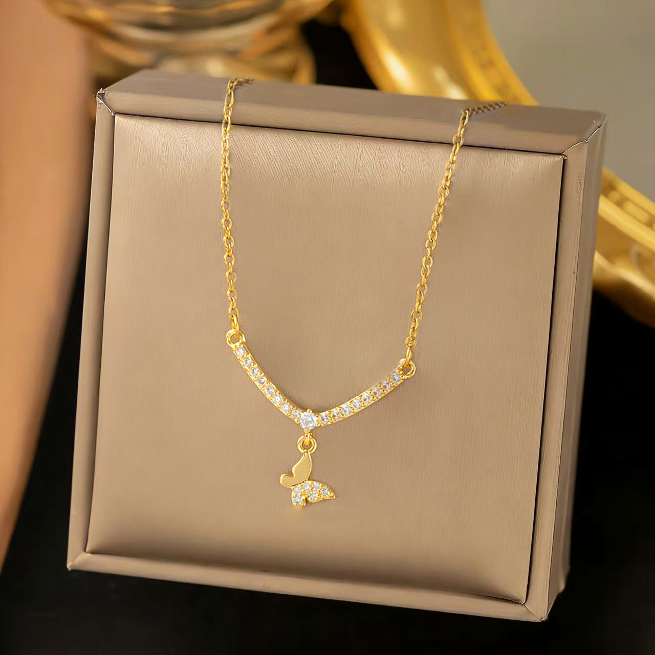 Unisex Butterfly Necklace With Tassel And Smiley Face Design In Golden Color
