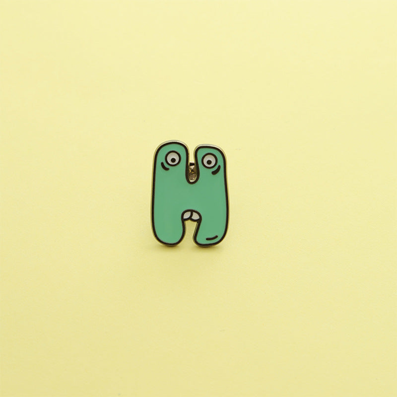 Letter Pin Brooch Featuring Cartoon Design In Durable Zinc Alloy Material