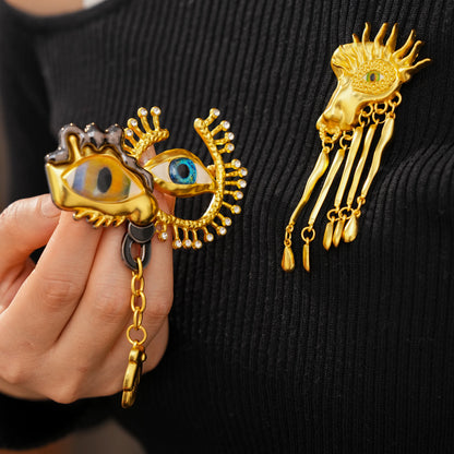 Golden Eye Pin Made Of Resin Featuring Artificial Diamond Inlay