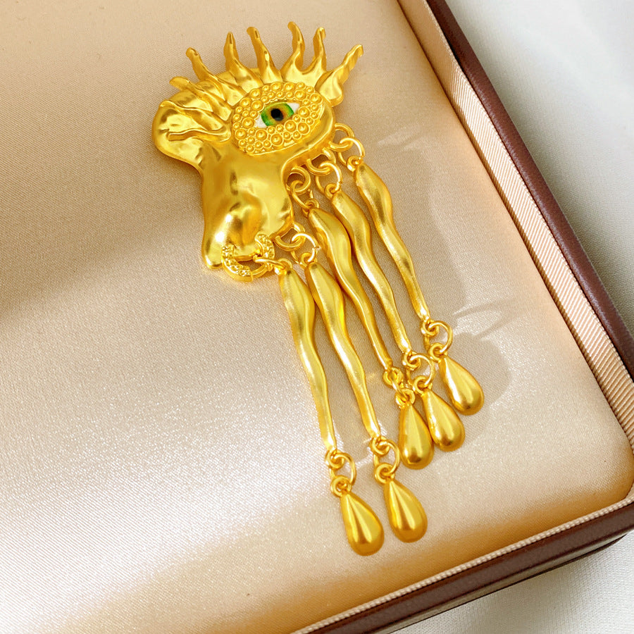 Golden Eye Pin Made Of Resin Featuring Artificial Diamond Inlay