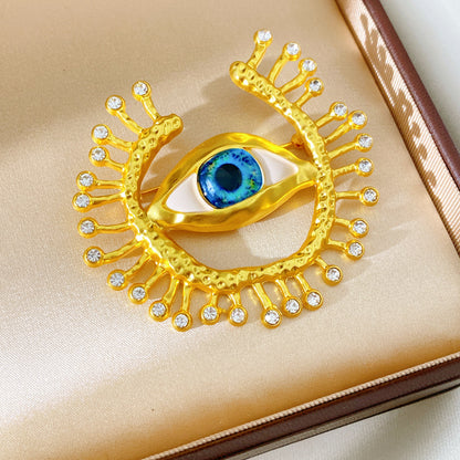 Golden Eye Pin Made Of Resin Featuring Artificial Diamond Inlay