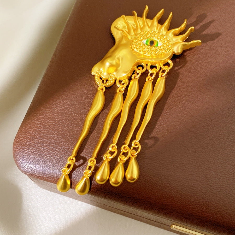 Golden Eye Pin Made Of Resin Featuring Artificial Diamond Inlay