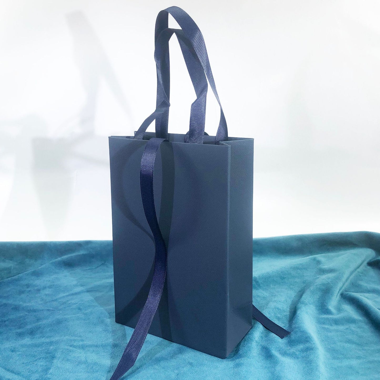 Paper Jewelry Box With Bow Tie Design In Dark Blue, Featuring Love Charms For Elegant Jewelry Packaging