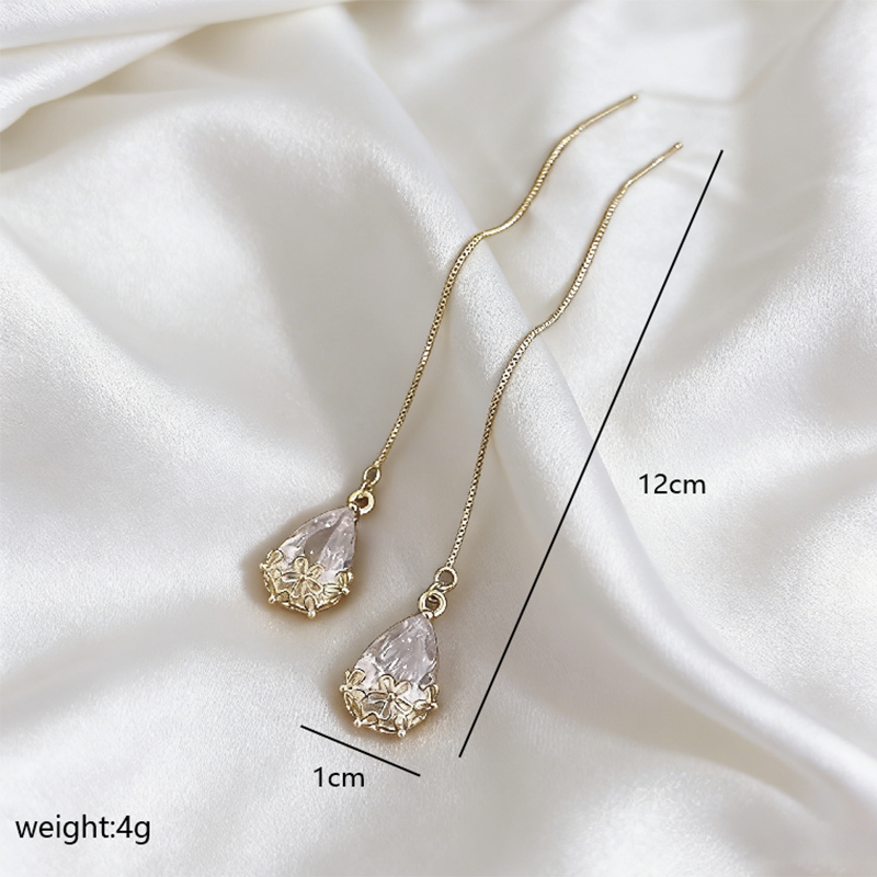 For Women Wedding Season Water Droplets Drop Earrings In Golden Plated Copper With Artificial Diamond Inlay