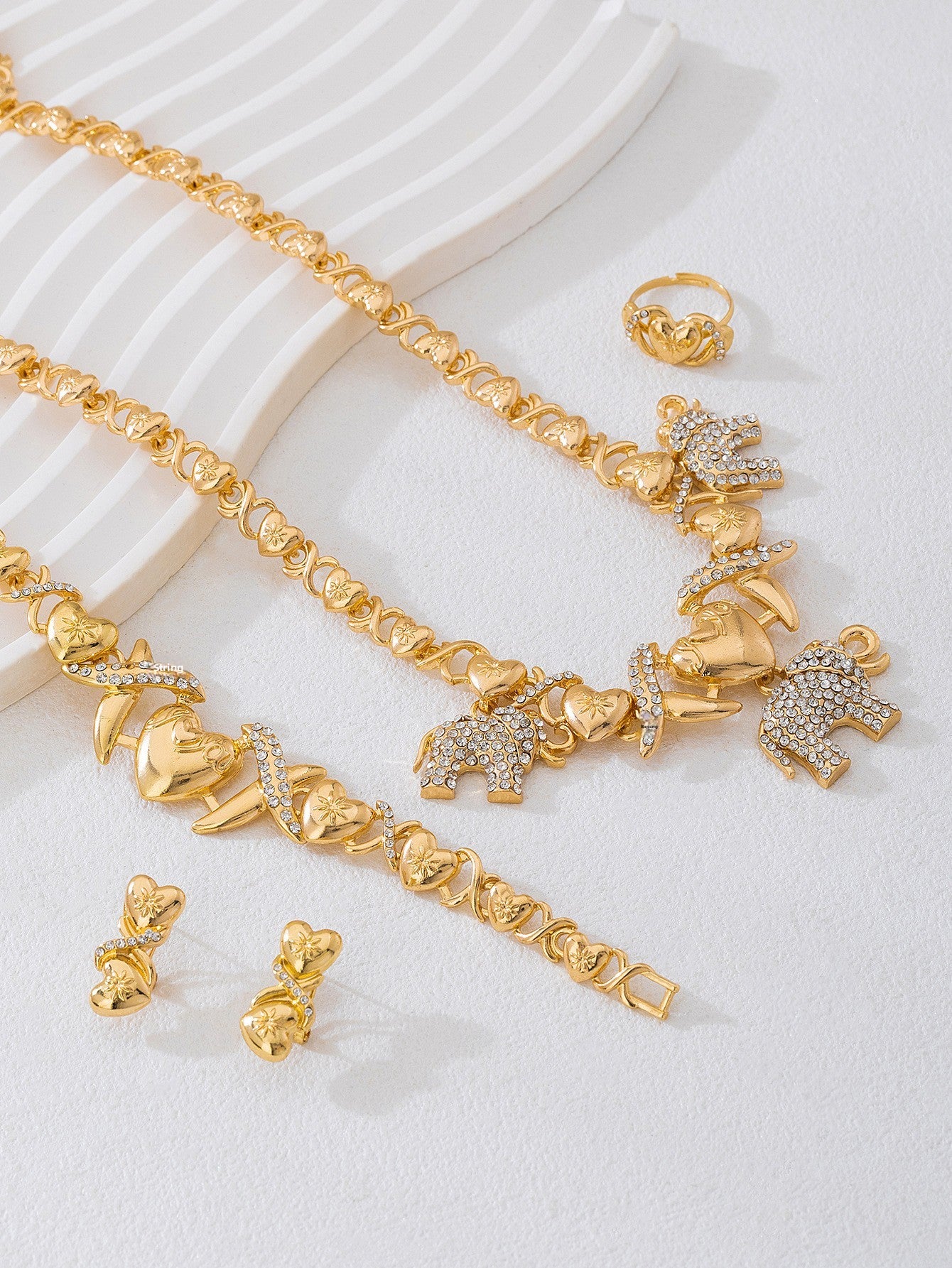 Elegant Golden Jewelry Set Featuring Timeless Design For Special Occasions